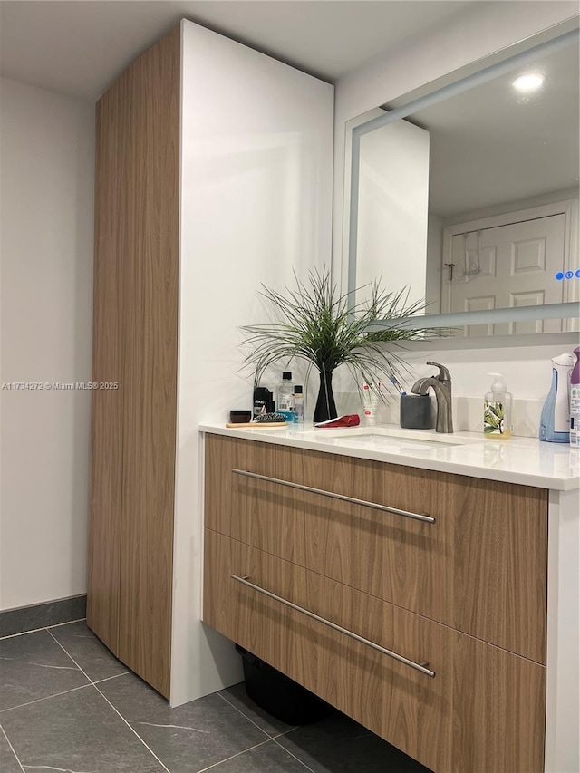 bathroom with vanity and tile patterned flooring