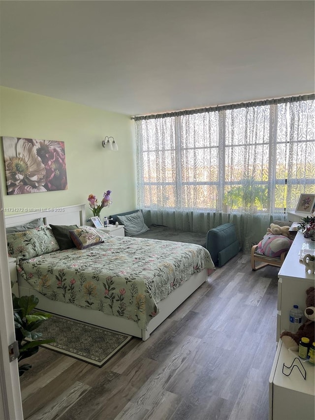 bedroom with hardwood / wood-style flooring