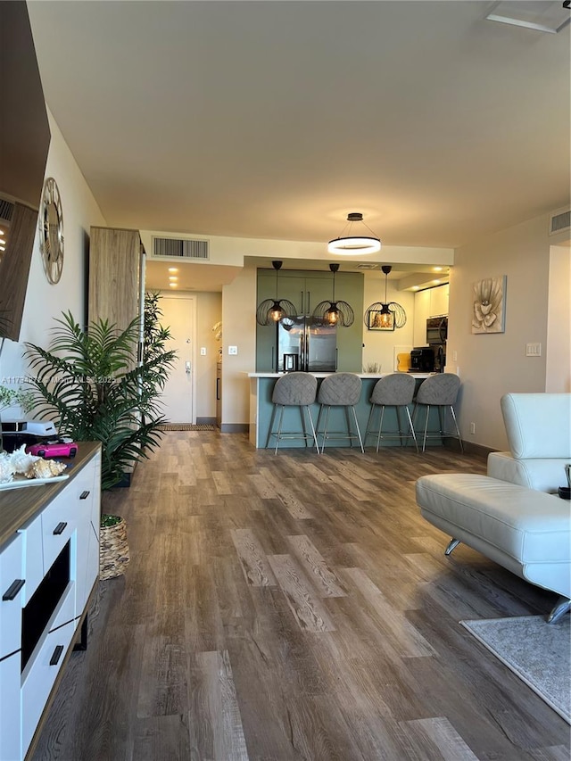 living room featuring dark hardwood / wood-style floors