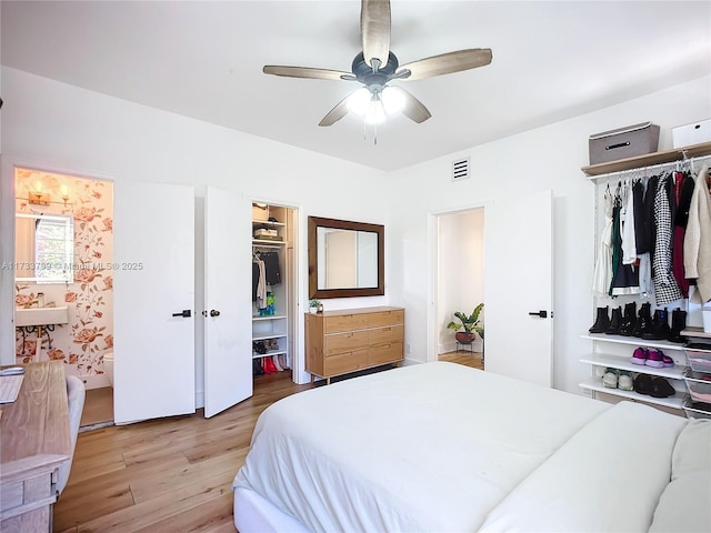 bedroom with light hardwood / wood-style flooring and ceiling fan