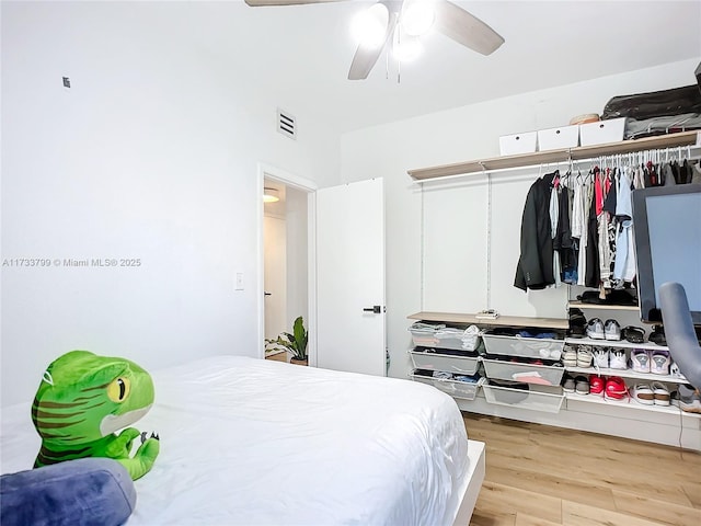 bedroom featuring ceiling fan and light hardwood / wood-style floors