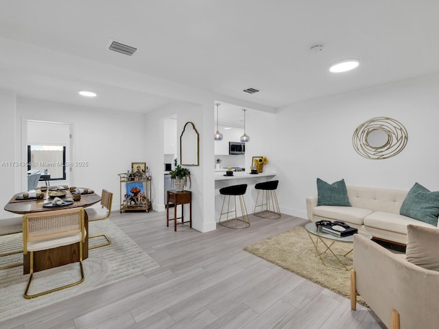 living room featuring light wood-type flooring