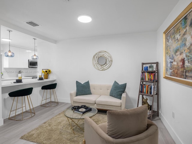 living room featuring light wood-type flooring