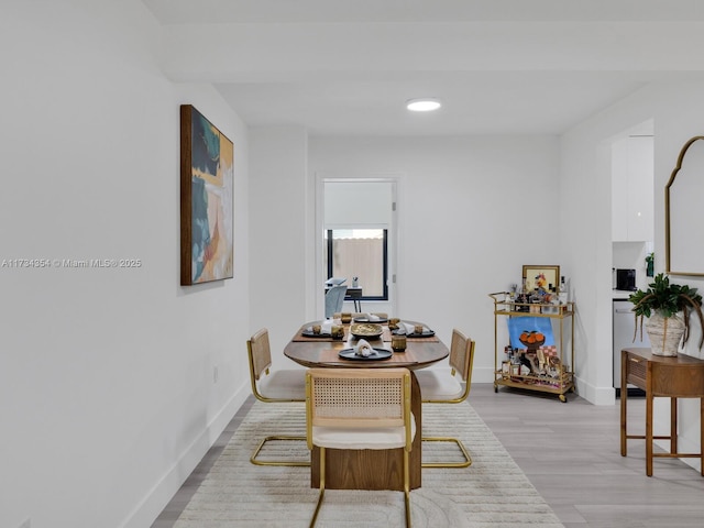 dining room with light hardwood / wood-style flooring