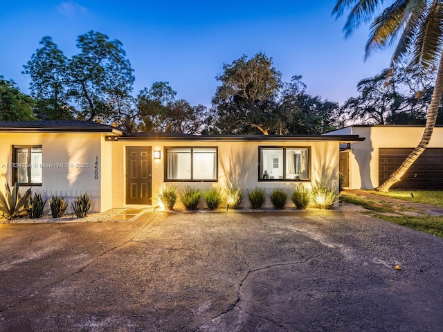 ranch-style home with a garage