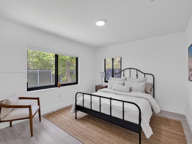 bedroom with light hardwood / wood-style floors