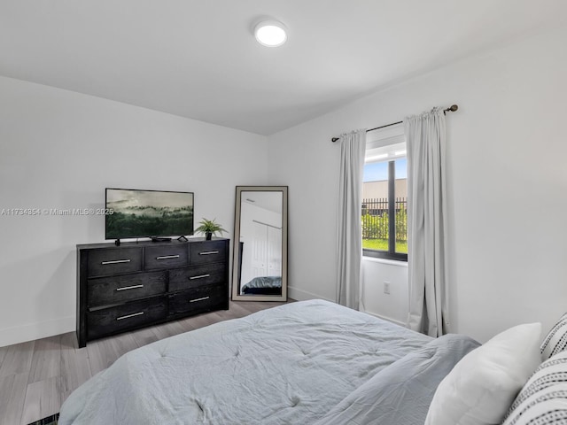 bedroom with light hardwood / wood-style floors