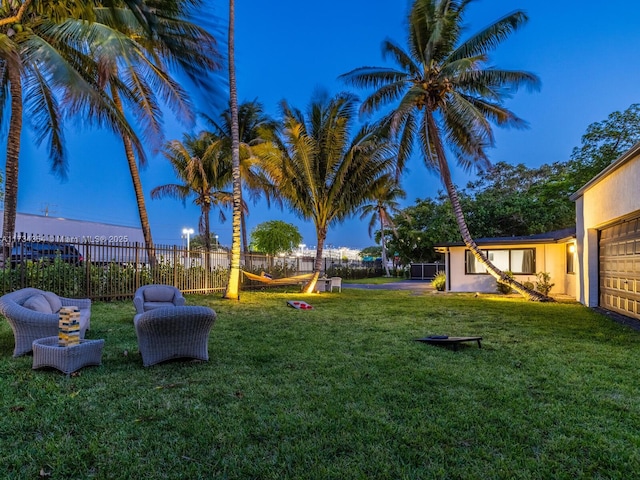 view of yard at dusk