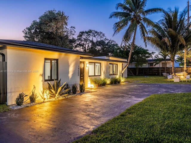 view of front of home with a lawn