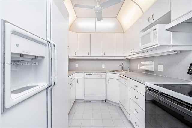 kitchen with light tile patterned flooring, sink, white cabinetry, white appliances, and exhaust hood