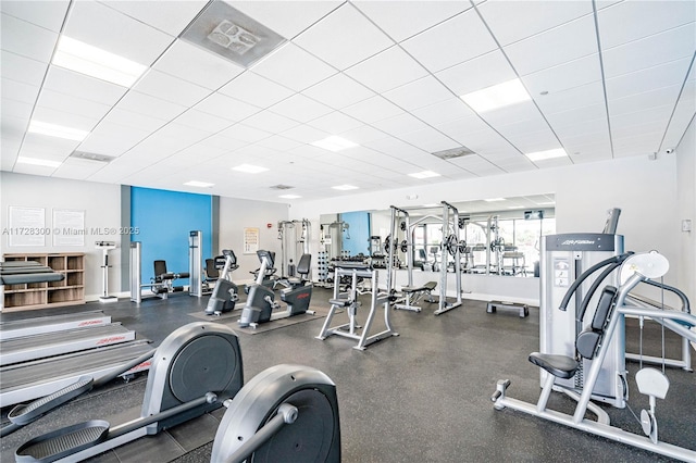 exercise room featuring a paneled ceiling