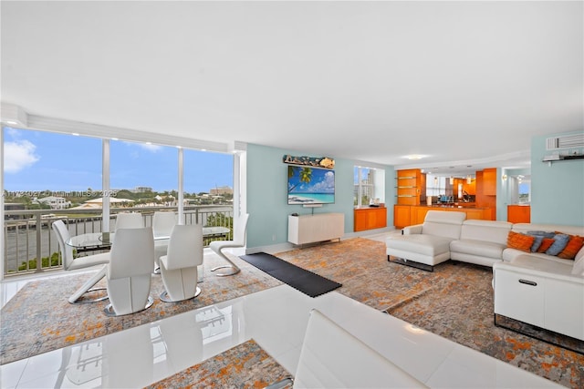 living room with expansive windows and tile patterned floors