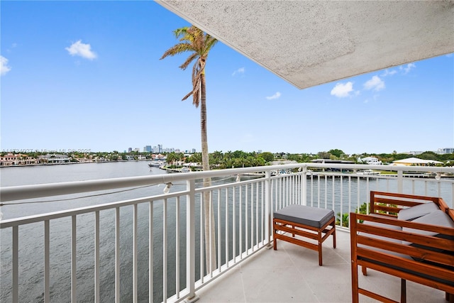 balcony featuring a water view