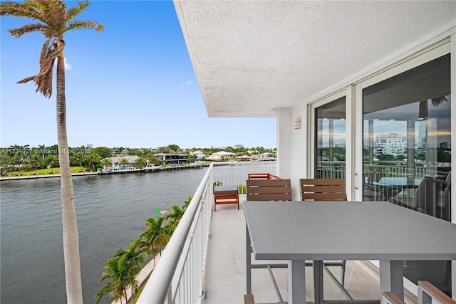 balcony featuring a water view