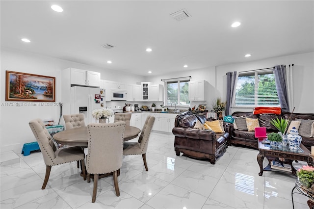 dining area featuring recessed lighting, marble finish floor, and visible vents