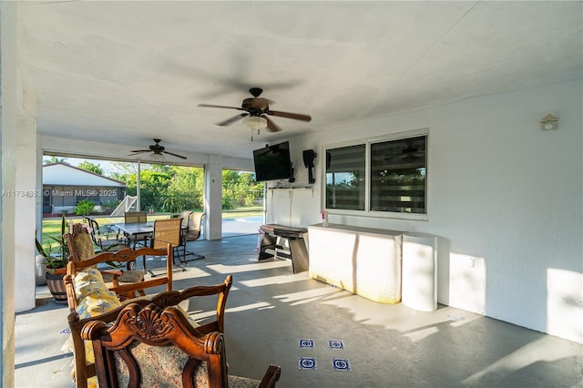 view of patio / terrace with ceiling fan and outdoor dining area