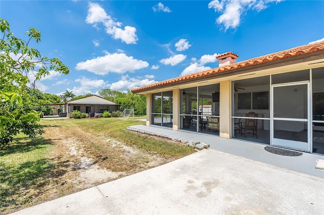 view of yard with a sunroom