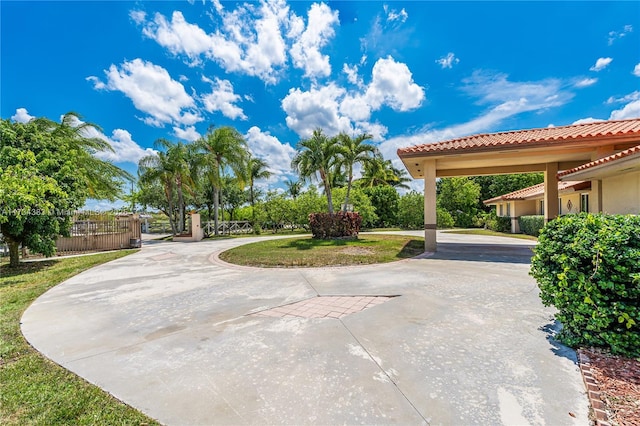 exterior space with driveway and fence