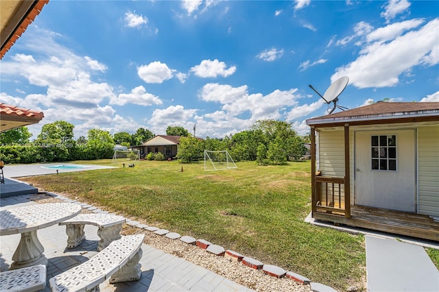 view of yard with a patio area and a fenced in pool