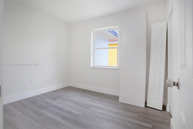 unfurnished room featuring light wood-type flooring