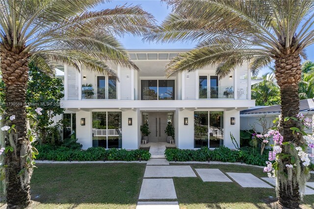 view of front of property with a front lawn