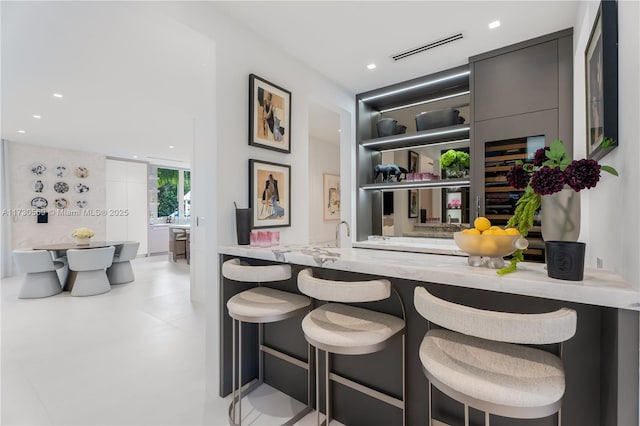 bar featuring recessed lighting and visible vents