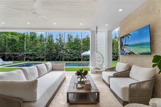 sunroom / solarium with a ceiling fan