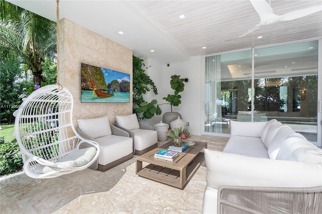 living area featuring recessed lighting and expansive windows