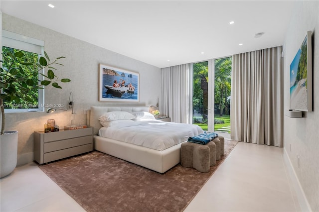 bedroom with a wall of windows, recessed lighting, and baseboards