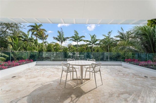 view of patio / terrace with outdoor dining space and fence