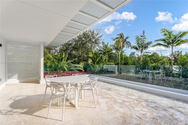 view of patio / terrace featuring outdoor dining space and fence