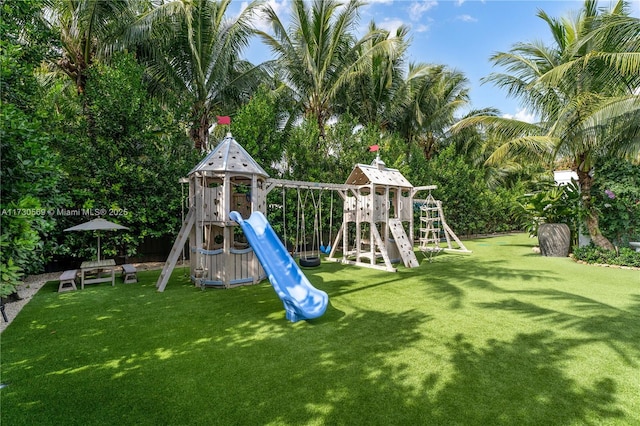 communal playground with a lawn