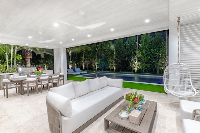 view of patio featuring outdoor dining space, a ceiling fan, an outdoor pool, and an outdoor hangout area