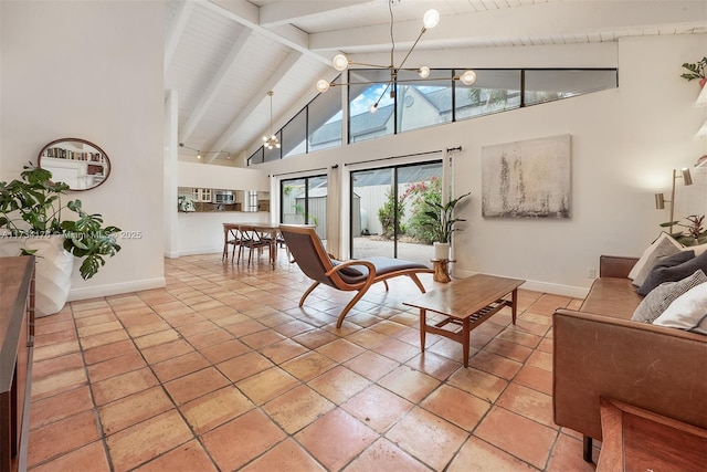 living room with beam ceiling, light tile patterned floors, wood ceiling, and high vaulted ceiling