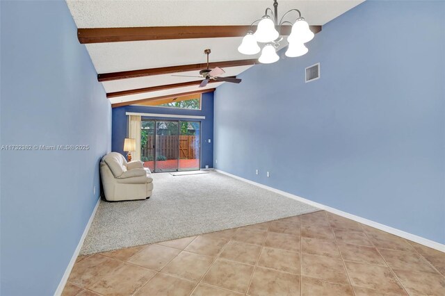 interior space featuring ceiling fan with notable chandelier, vaulted ceiling with beams, and light carpet