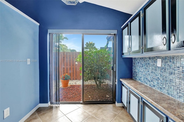 doorway to outside featuring light tile patterned floors