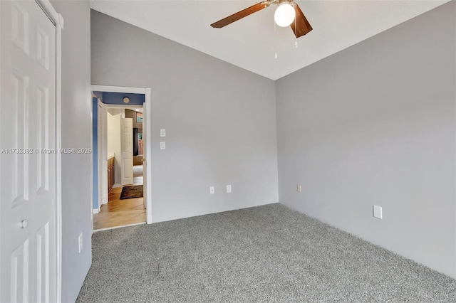 interior space featuring lofted ceiling and ceiling fan