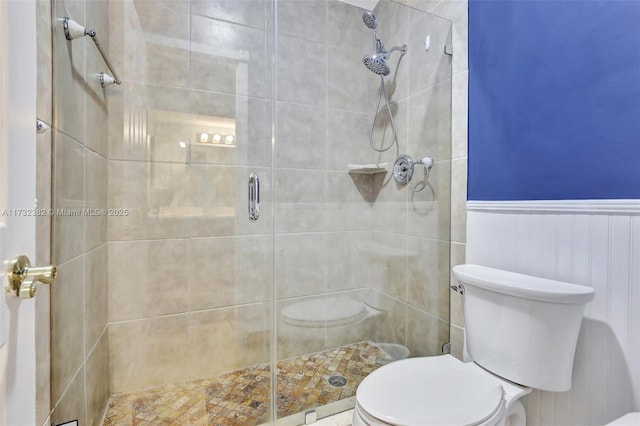 bathroom with walk in shower and toilet