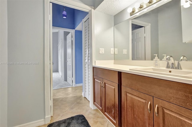 bathroom with tile patterned floors and vanity