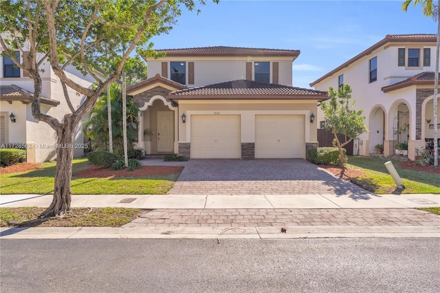 mediterranean / spanish-style home featuring a garage and a front lawn