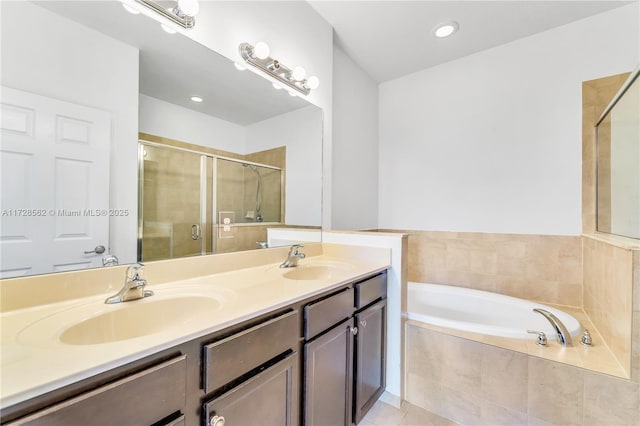 bathroom featuring tile patterned floors, vanity, and independent shower and bath