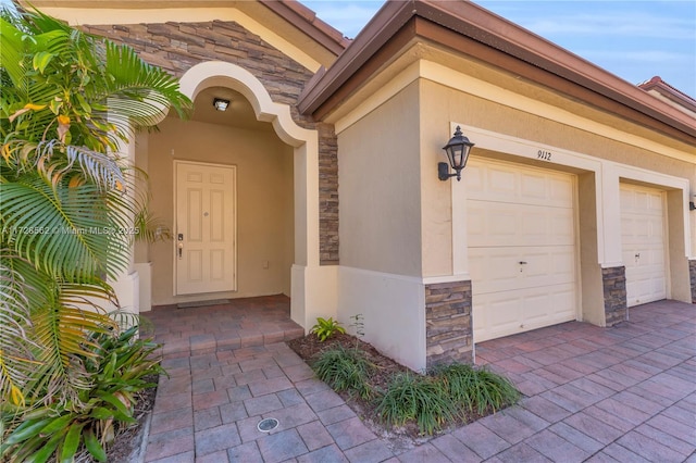 entrance to property featuring a garage