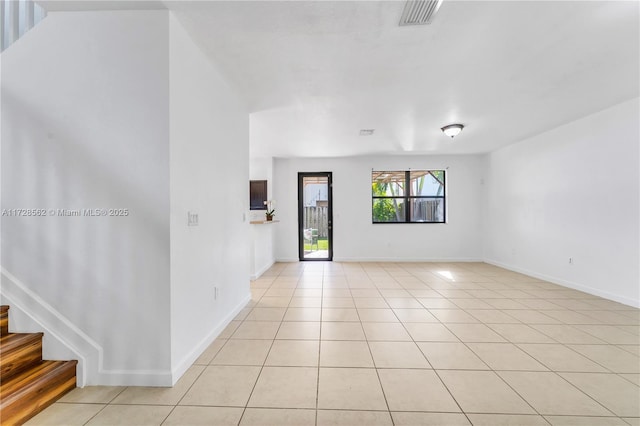 unfurnished room featuring light tile patterned floors