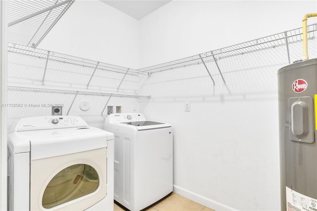 washroom featuring washer and dryer and electric water heater