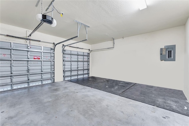 garage featuring a garage door opener and electric panel