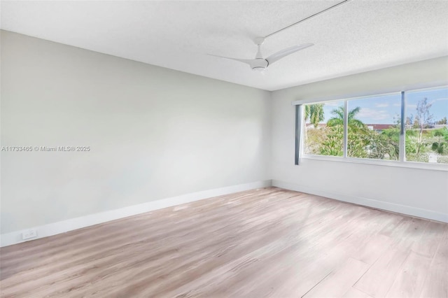 1401 SW 128th Ter Unit 307H, Pembroke Pines, FL 33027 - unfurnished room featuring a textured ceiling, ceiling fan, baseboards, and light wood finished floors