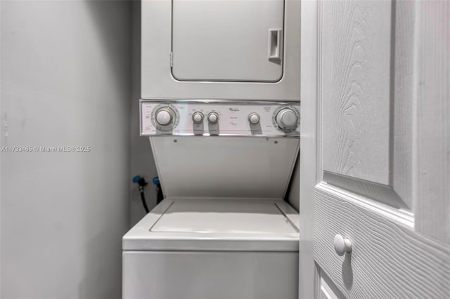 1401 SW 128th Ter Unit 307H, Pembroke Pines, FL 33027 - laundry room featuring laundry area and stacked washing maching and dryer