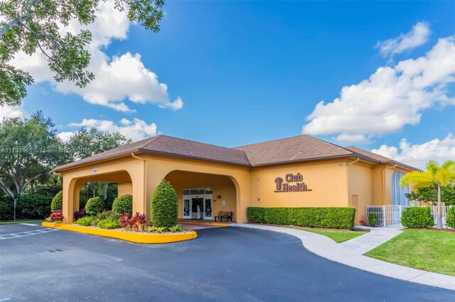 1401 SW 128th Ter Unit 307H, Pembroke Pines, FL 33027 - view of property with uncovered parking