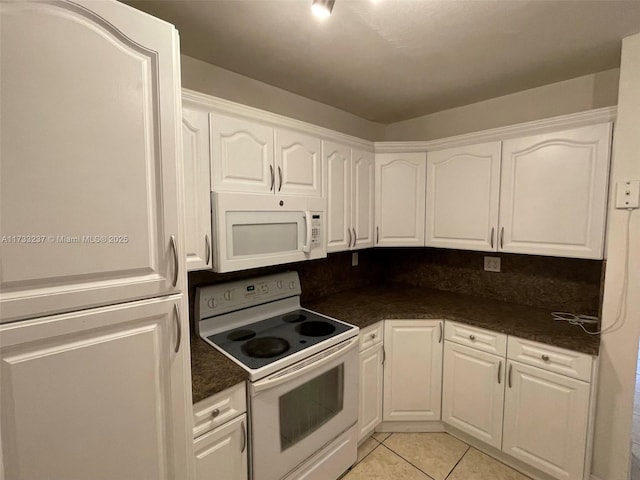 kitchen with white cabinetry, white appliances, and light tile patterned flooring