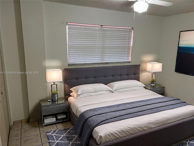 tiled bedroom with ceiling fan